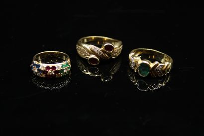 null Lot of 18k (750) yellow gold comprising: 
- a ring set with sapphires, emeralds,...