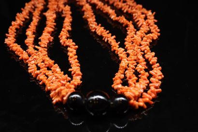 null Multi-strand coral necklace adorned with three fancy black beads. 
Necklace...