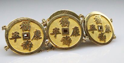 null Gold bracelet 18K (750) composed of six Sapecs. 
Indochinese work of the 1950s.
Diameter:...