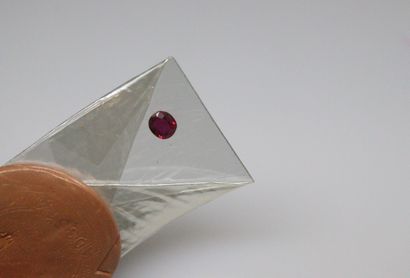null Ruby under seal with a report indicating natural ruby.
Weight : 1.21 ct