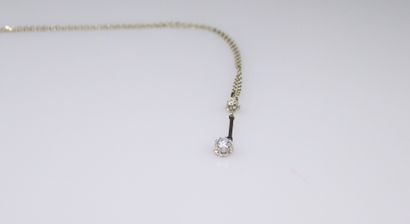 null Necklace in 18K (750) white gold and its pendant holding two diamonds, the main...