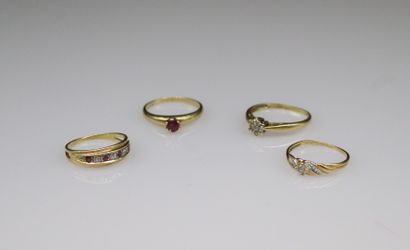 null Lots of four rings of various titles:
- Three 18k (750) yellow gold rings, adorned...
