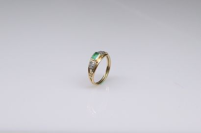 null 18k (750) yellow and white gold ring set with an emerald and diamonds. 
A 14k...