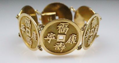 null Gold bracelet 18K (750) composed of six Sapecs. 
Indochinese work of the 1950s.
Diameter:...