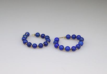 null Creole in yellow gold 18k decorated with lapis-lazulis pearls.
Diameter: about...