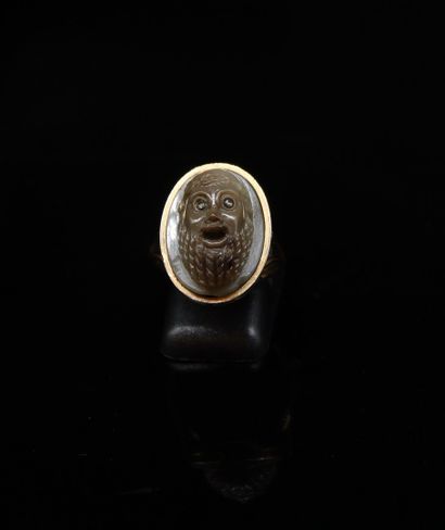 null Agate cameo representing a bearded man's head, a brilliant and a zircon forming...