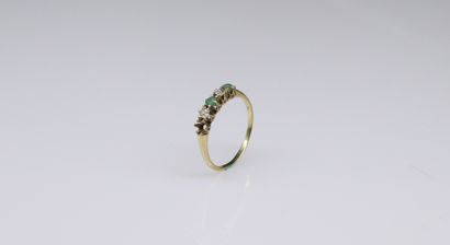 null 18k (750) yellow and white gold ring set with an emerald and diamonds. 
A 14k...