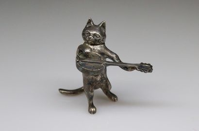 null Silver plated needle box featuring a cat playing guitar, the head forms the...