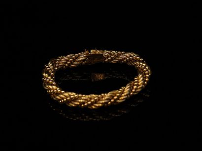 null Bracelet in yellow gold 18k (750) with braided mesh alternated with a line of...