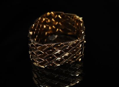 null Bracelet articulé en or jaune 18k (750).
Tour de poignet : env. 19 cm - Poids....