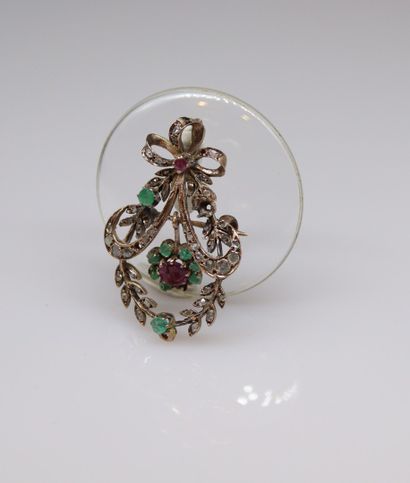 null Metal pendant-brooch forming a crown of foliage adorned with rubies, emeralds...
