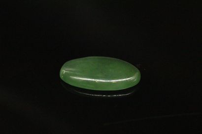 null Oval serpentine cabochon on paper. 
Weight : 20.39 cts.

Dimensions : 28mm x...