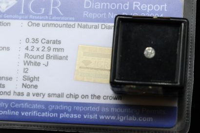 null White J" round diamond under seal.

Accompanied by a report from the IGR attesting...