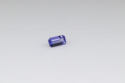 Rectangular Tanzanite with cut sides on paper....