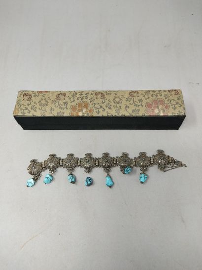 null Silver filigree bracelet with geometrical patterns decorated with turquoise...