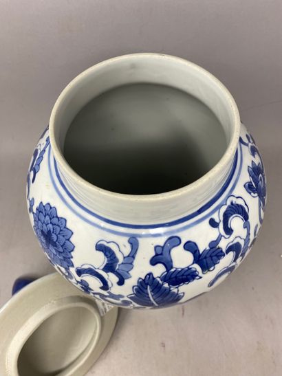 null MODERN CHINA 
Covered pot with blue and white decoration of scrolls and flowers...