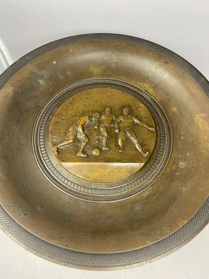 null DEMEY. H, large bronze cup supported by a marble base, for the Trojan sports...