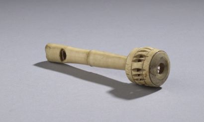 null Rattle with a bell forming a whistle in carved and openworked bone.
19th century
Height...