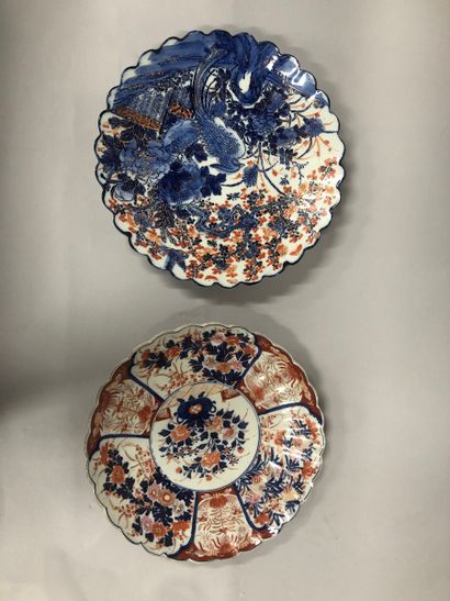 Two earthenware dishes with scalloped edges....