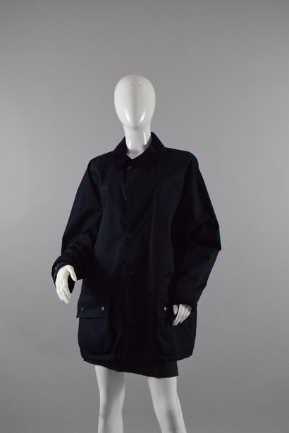 null BARBOUR

Navy jacket with front zip and velvet collar. 
"Lightweight beaufort....