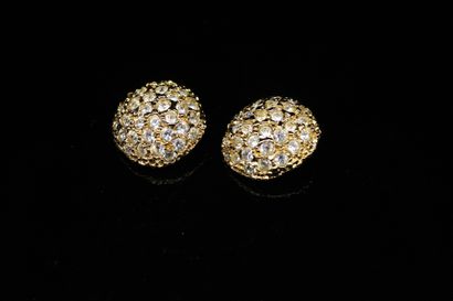 null YVES SAINT LAURENT
Circa 1985

Pair of round dome-shaped ear clips, in gold-plated...