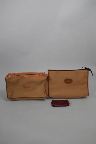 null LANCEL 
Circa 1970

Set of three travel items, in canvas and leather or leather....