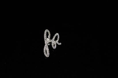 null SONIA RYKIEL (Attributed to)

A metal and rhinestone pin featuring the letters...