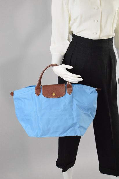 null LONGCHAMP

Set of two bags models "Pliage", a handbag and a backpack. 
The first...