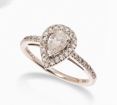 null MESSIKA
18K (750) white gold ring, set with a drop-cut diamond surrounded and...