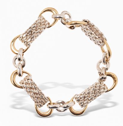 null HERMÈS
Bracelet in silver links alternated with rings, and stylized stirrups...