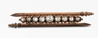 null Ensemble de bijoux comprenant : un bracelet ouvrant en or 18K (750) et argent...