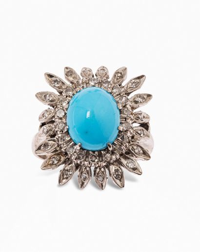 null 18K (750) white gold flower ring, the heart set with an oval cabochon turquoise,...