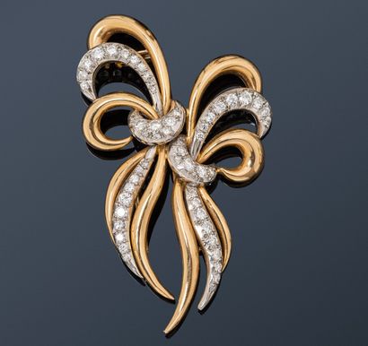 null 18K (750) gold and platinum clip brooch set with round brilliant and 8/8 diamonds....
