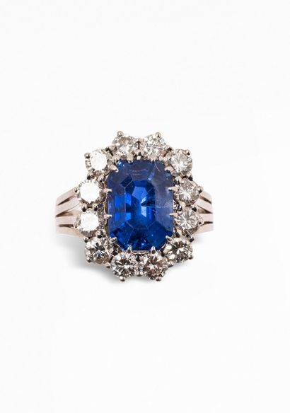 null 18K (750) white gold and platinum ring set with an octagonal sapphire surrounded...