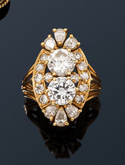 null 18K (750) gold wire navette ring, set with two round brilliant-cut diamonds...