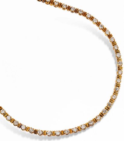 null Half set in gold comprising: a necklace in 14K gold articulated with 56 round...