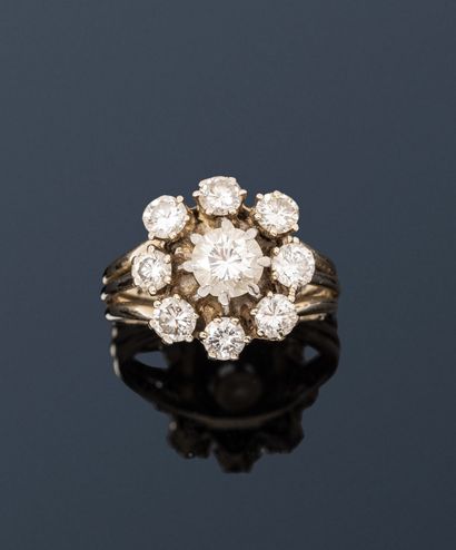 null Bague fleur stylisée en fils d'or gris 18K (750), sertie de diamants ronds de...
