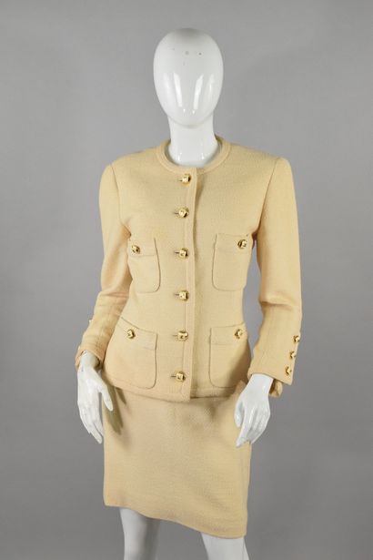 null CHANEL Boutique 
Circa fin 1980

Veste en bouclette beige, quatre poches plaquées...