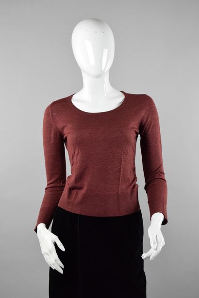 null TED LAPIDUS Haute Couture
Circa 1980

Dark pink fluid knit sweater with round...