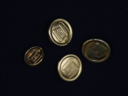 null CHANEL 

Lot of four golden metal buttons decorated with a handbag, probably...