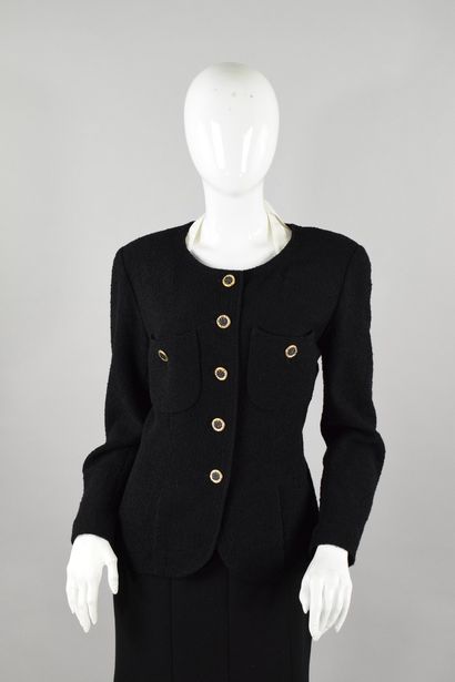 null CHANEL Boutique 
Circa 1990

Jacket in black bouclette, two patch pockets with...