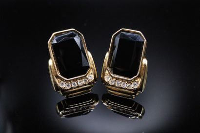 null YVES SAINT LAURENT 
Circa late 1980

Pair of gold-plated metal ear clips adorned...