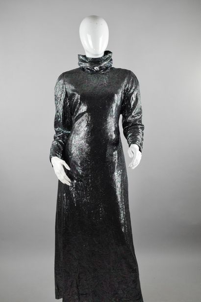 null ANONYMOUS 

Long dress with a slit in the back and a flowing funnel neck, embroidered...