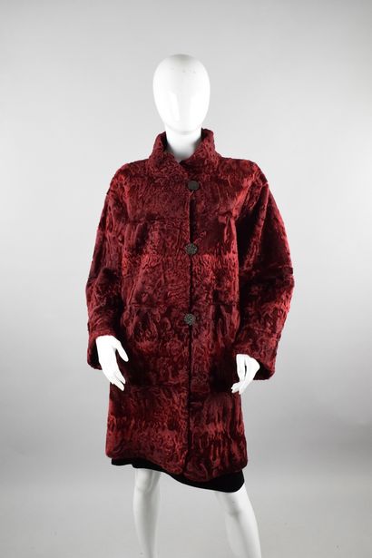 null YVES SAINT LAURENT Furs
Circa late 1970

Rare coat in burgundy astrakhan, reversible...