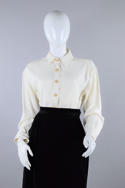 null YVES SAINT LAURENT Left Bank 
Circa 1985

Ecru blouse with important golden...