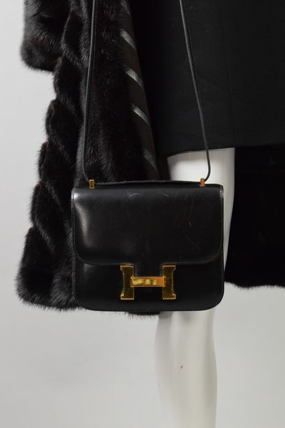 null HERMES PARIS 
Circa 1970

Bag model "Mini Constance" in black box leather and...