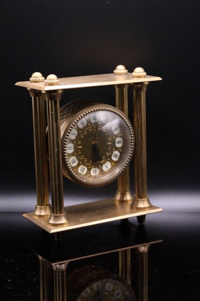 null LANCEL

Gilt brass desk clock with four columns, the round dial with gold background,...