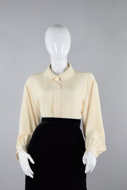 null YVES SAINT LAURENT Left Bank
1991

Eggshell blouse with large gold button stripes...