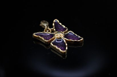 null YVES SAINT LAURENT 

Gold-plated metal pendant stylizing an enamelled butterfly....