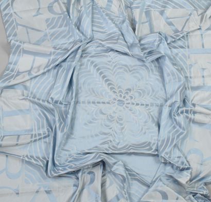 null CARTIER

Large pale blue silk shawl with geometric overprints and CARTIER. 
Slight...